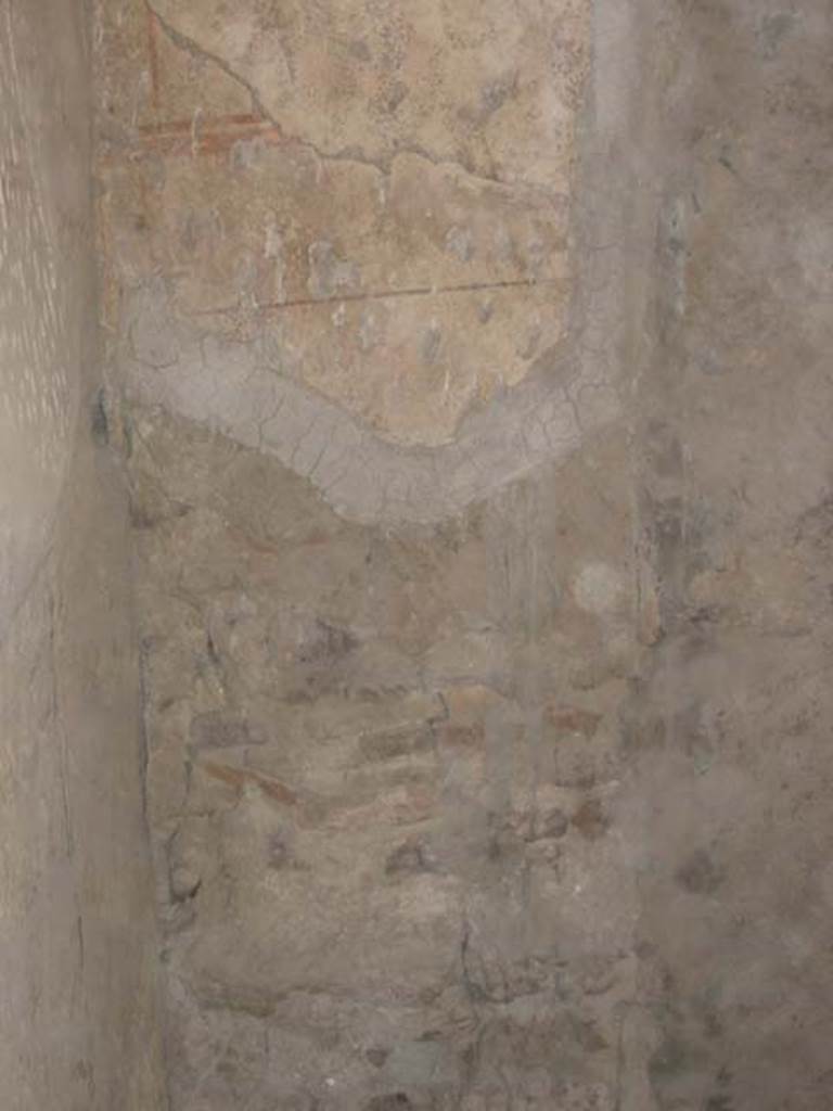 III 15, Herculaneum, May 2003. 
Painted decoration on south end of west wall of shop room. Photo courtesy of Nicolas Monteix.